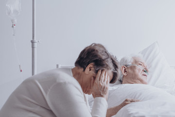 Woman watching his ill husband