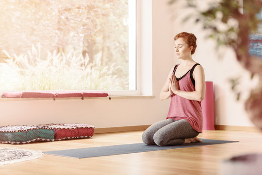 Relaxed woman in yoga center