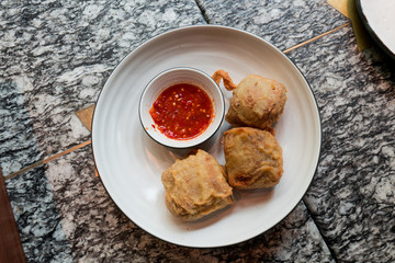 Indonesian traditional food: deep fried tofu with spicy sauce.
