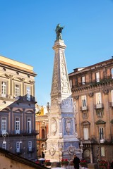 Fototapeta na wymiar The obelisk of San domenico church and square in Naples, Italy