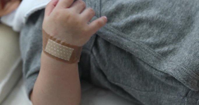 medical plaster on hand a baby