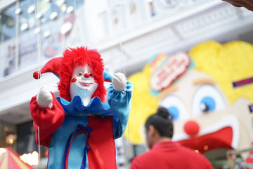 Clown puppet with abstract blur of carnival festival background for Christmas and New Year...