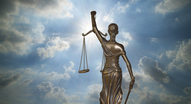Lady of Justice against light of God