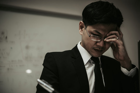 Close up stress Asian businessman,Fail from work,Thailand people,Not success from business,Sadness man concept