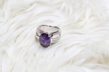purple gemstone on silver ring