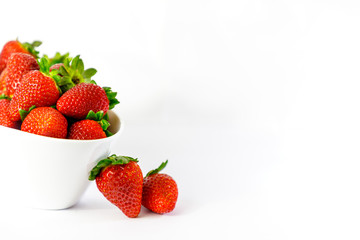 strawberries on white bowl with white background