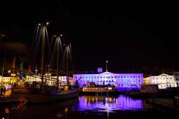 Fototapeta na wymiar Helsinki city hall and sailing ship at night