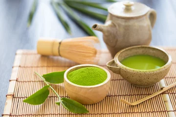 Keuken foto achterwand Thee Set of matcha powder bowl wooden spoon and whisk green tea leaf Organic Green Matcha Tea ceremony