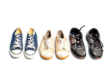 vintage used shoes on white background.Old sneakers on white.