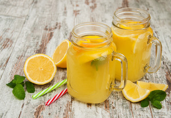 Obraz na płótnie Canvas Jars with lemonade