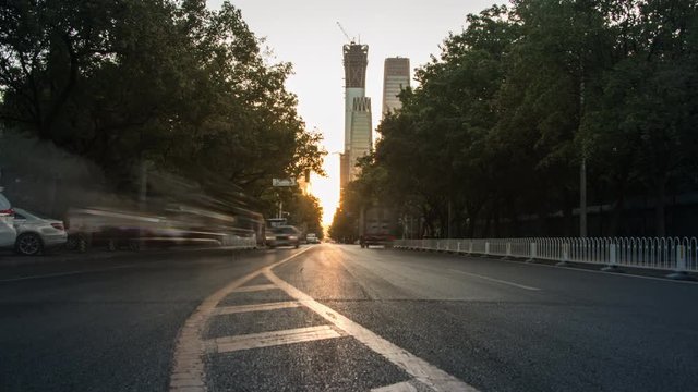 Timelapse.Street at Sunrise with Skyscrapers and Traffic Flow,Beijing,China