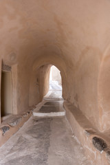 Narrow street in traditional Cycladic style Emporio village, santorini