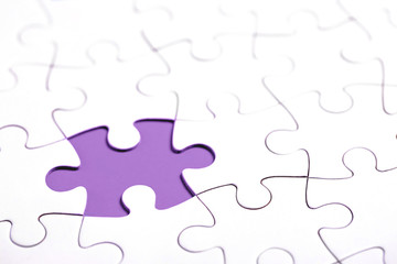 White puzzle with missing part