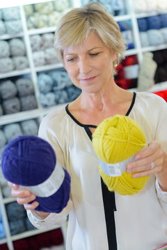 choosing wool at haberdashery
