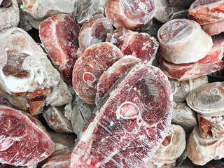 Peaces of frozen raw meat, turkey in supper market