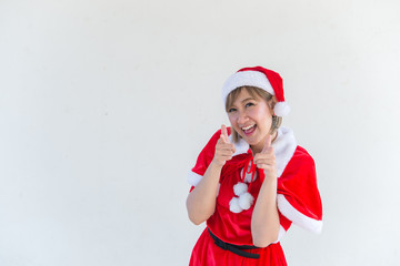 Obraz premium Beautiful young asian woman in Santa Claus clothes on white background,Thailand people,Sent happiness for children,Merry christmas,Welcome to winter,Happy woman concept