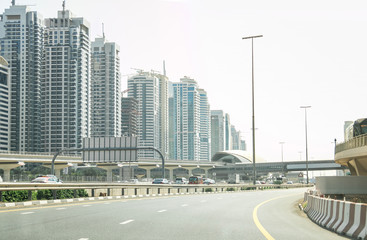 Modern Cityscape Architecture Construction Buildings with Blue Sky and Highway Road