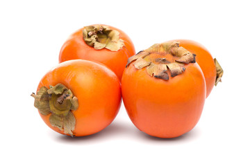 Persimmon fruits on white