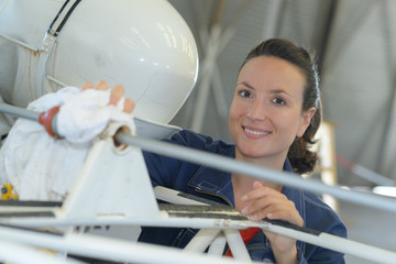 Portrait of woman in aircraft hangar