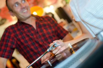 People playing a vinyl record