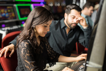 Couple losing money in a casino