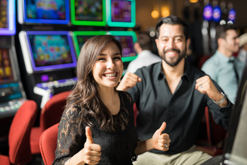 Fototapeta premium Couple having some fun in a casino