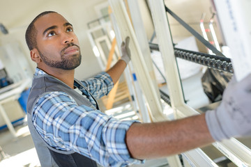 Man holding window frame
