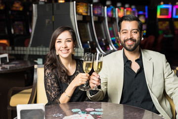 Couple drinking champagne in a casino