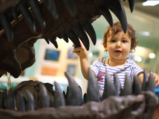 Little baby in dinosaur mouth looking teeth © FotoAndalucia