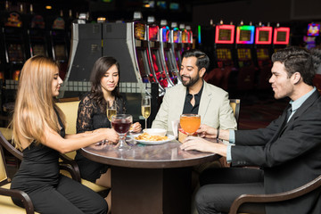 Friends eating dinner in a casino