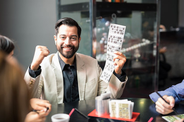 Man winning at bingo in a casino