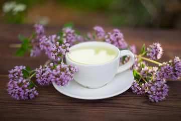 delicious  oregano tea in a beautiful glass bowl on table