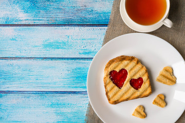 Grilled toast with raspberry jam and tea