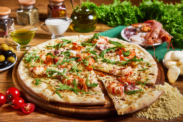 Freshly cooked pizza on the wooden table