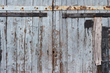Exterior doors of an old wooden barn in village