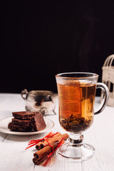hot green tea with cinnamon on white background