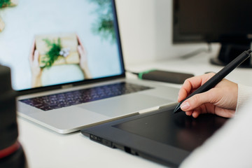 retouching on computer laptop