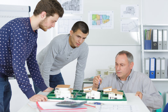 students in architecture class with trainer