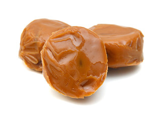 Caramel candies isolated on white background