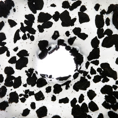 Overfill black and white doughnut closeup