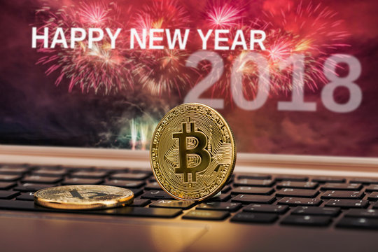 Happy new year 2018 with fireworks background. Celebration New Year 2018. Close up golden bitcoin coin crypto Currency background concept.