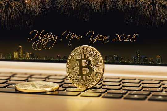 Happy new year 2018 with fireworks background. Celebration New Year 2018. Close up golden bitcoin coin crypto Currency background concept.
