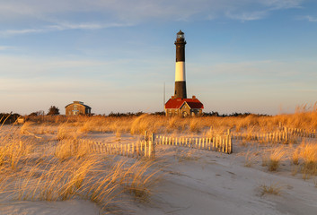 Scenic Fire Island Lighthouse with beach, dunes, dune grasses in late afternoon light.