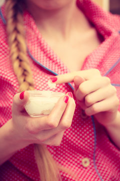 Moisturizing cream in female hands. Skincare.