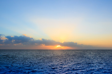 Rising in the clouds the sun. The red sea. Egypt.