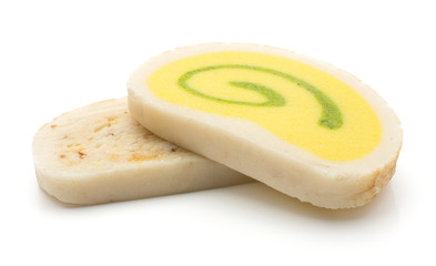 Two marzipan slices isolated on white background pineapple citron and rum almonds tastes yellow green beige colours.