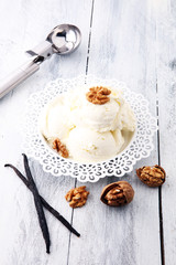 homemade oatmeal and walnut ice cream on wooden background