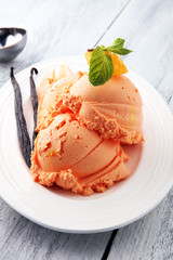 Winter Ice cream with tangerines, on wooden backgroundwith fresh mandarin