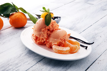Winter Ice cream with tangerines, on wooden backgroundwith fresh mandarin
