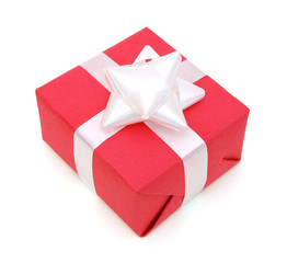 Red gift box with white ribbon isolated on white